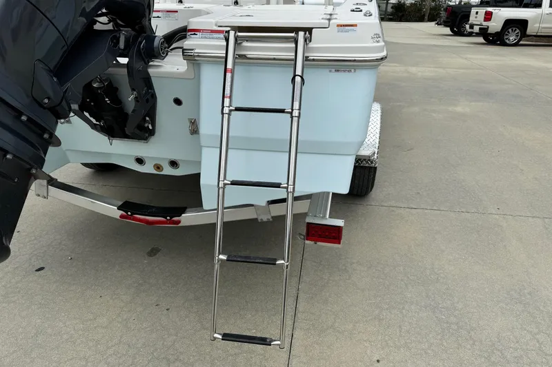 Slide: The Image of Rear view of 2026 Robalo 206 Cayman boat with ladder and motor. - 5