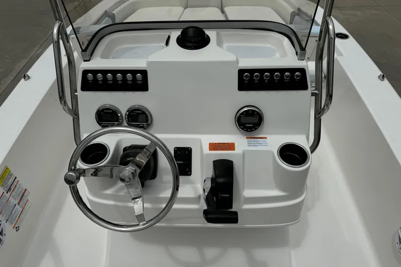 Slide: The Image of 2026 Robalo 206 Cayman boat dashboard with steering wheel and control panel. - 7