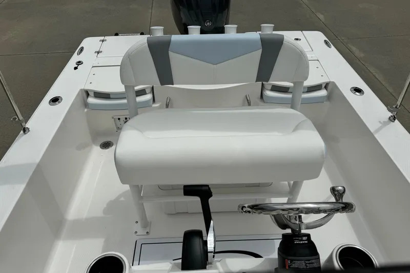Slide: The Image of 2026 Robalo 206 Cayman boat interior with steering wheel and seating. - 8