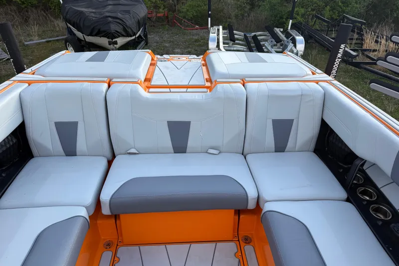 Slide: The Image of 2023 Malibu Wakesetter 23 LSV interior with white and orange seating. - 11