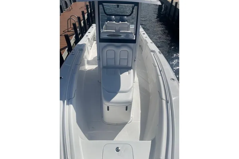 Slide: The Image of 2018 Sea Hunt Gamefish 27 Coffin Box boat docked by the water. - 12