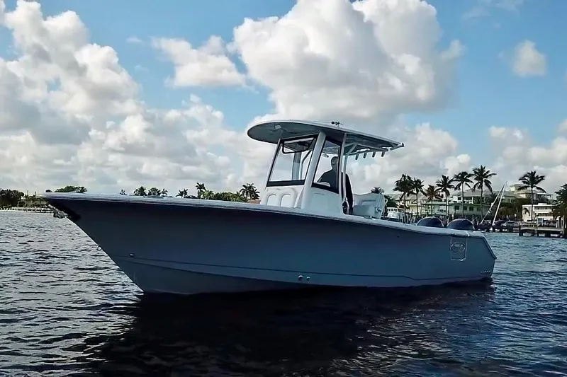Slide: The Image of 2018 Sea Hunt Gamefish 27 Coffin Box boat on water under cloudy sky. - 4