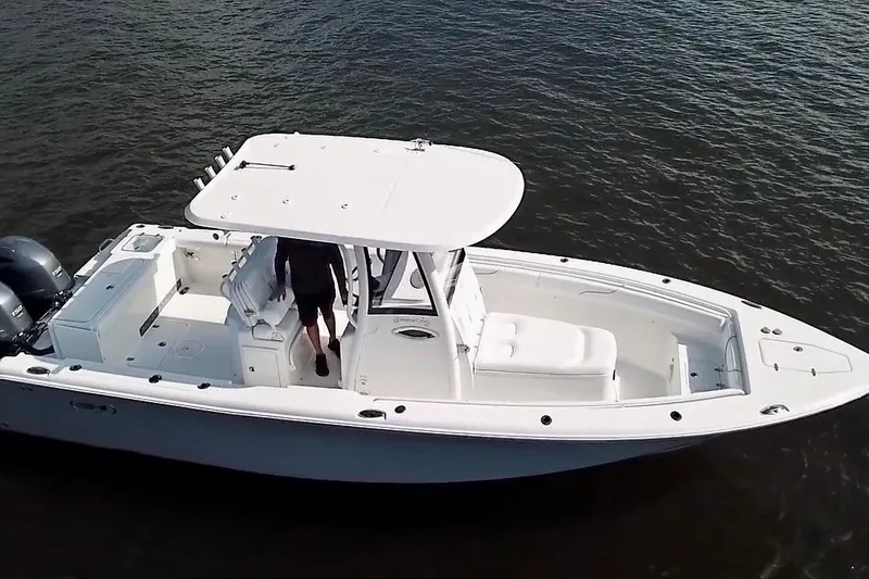 Slide: The Image of 2018 Sea Hunt Gamefish 27 Coffin Box boat on water, aerial view. - 6