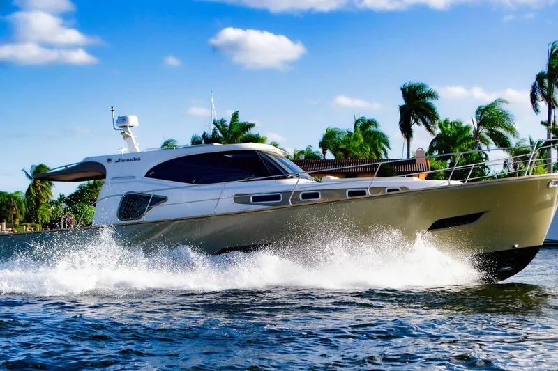 The Image of 2019 Monachus 45 Issa yacht cruising on water with palm trees in background. - 1
