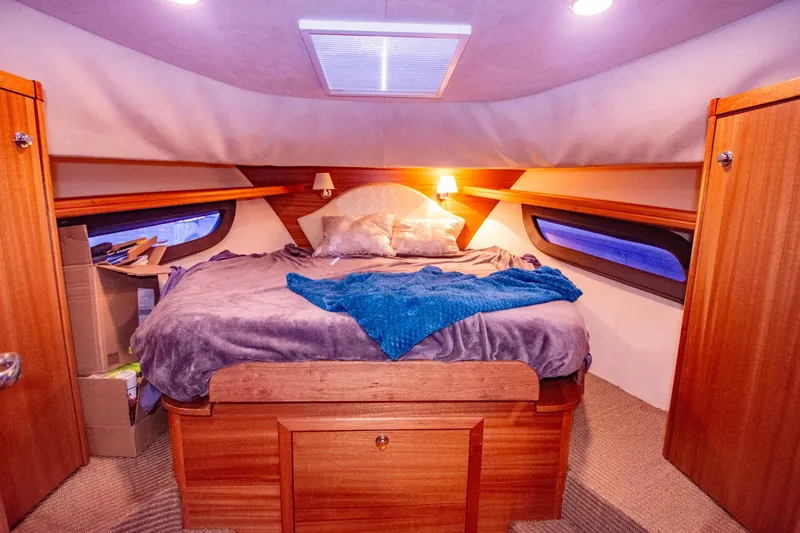 Slide: The Image of Cozy cabin bedroom in 2019 Monachus 45 Issa yacht with wooden accents and soft lighting. - 10