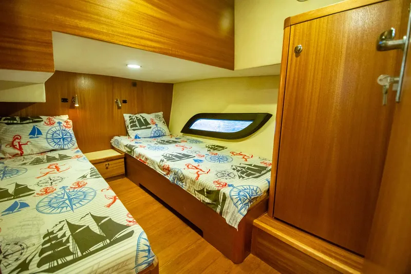 Slide: The Image of Cozy cabin interior of 2019 Monachus 45 Issa yacht with nautical-themed bedding. - 13