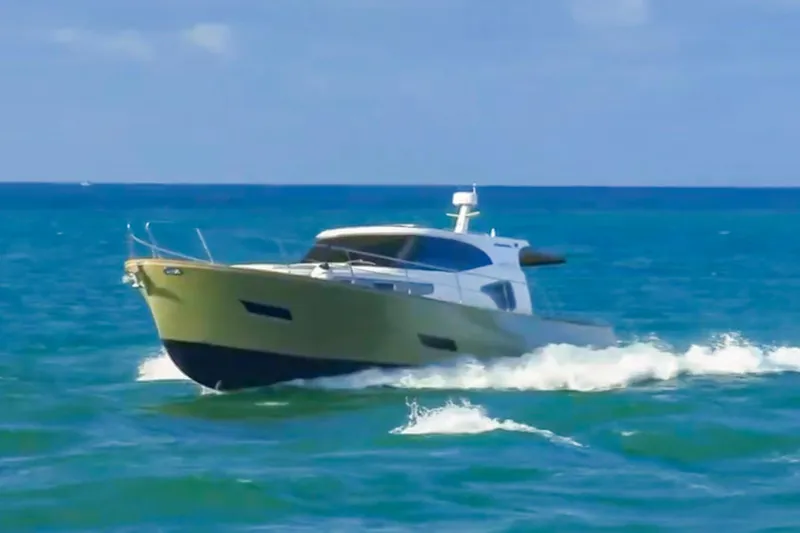Slide: The Image of 2019 Monachus 45 Issa yacht cruising on open blue sea. - 22
