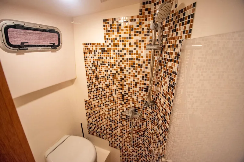 Slide: The Image of Bathroom with mosaic tiles and shower in 2019 Monachus 45 Issa yacht. - 26