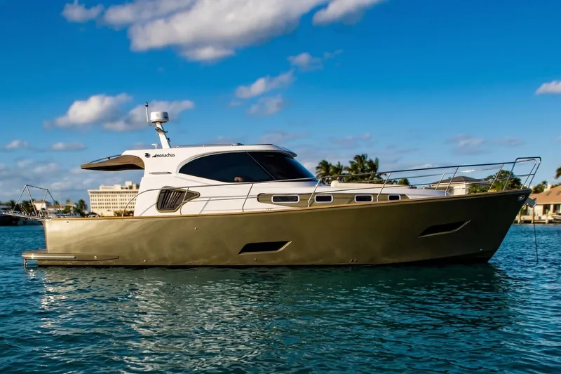 Slide: The Image of 2019 Monachus 45 Issa yacht on calm water under blue sky. - 6