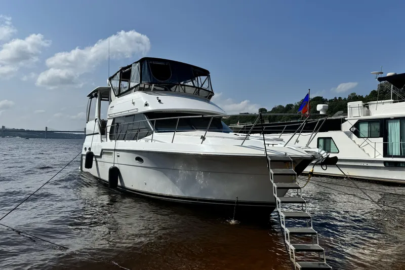 The Image of 2000 Carver 406 Aft Cabin Motor Yacht docked on a sunny day. - 0