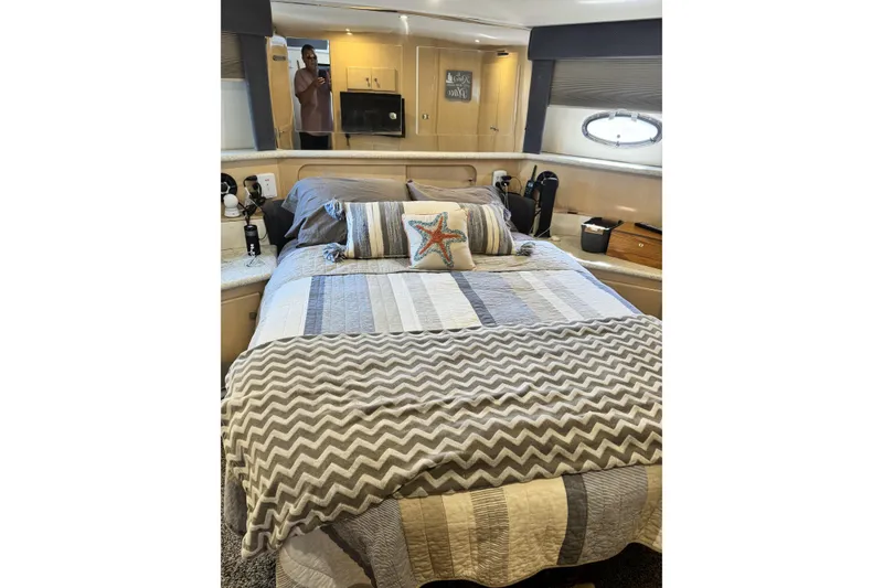 Slide: The Image of Interior of 2000 Carver 406 Aft Cabin Motor Yacht bedroom with cozy bedding. - 18