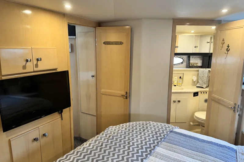 Slide: The Image of Interior of 2000 Carver 406 Aft Cabin Motor Yacht with cozy bedroom and bathroom. - 19