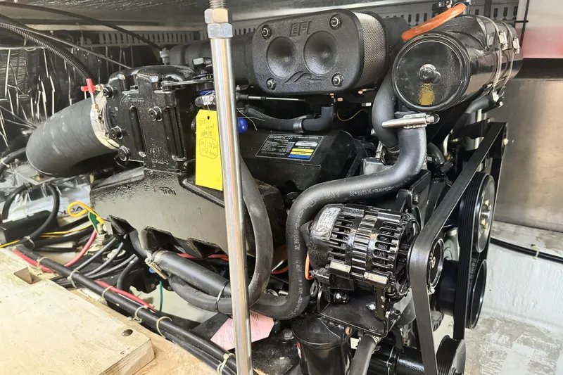 Slide: The Image of Engine of a 2000 Carver 406 Aft Cabin Motor Yacht, showcasing detailed components. - 24