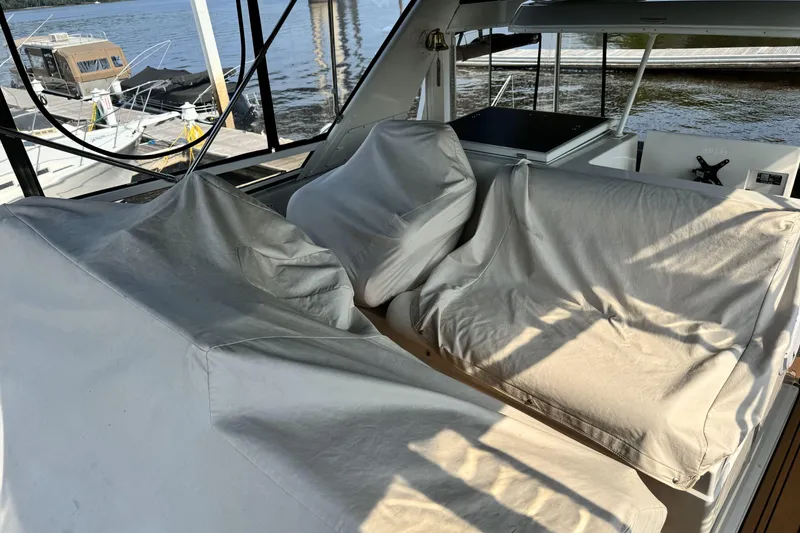 Slide: The Image of Covered seating area on a 2000 Carver 406 Aft Cabin Motor Yacht at a dock. - 25