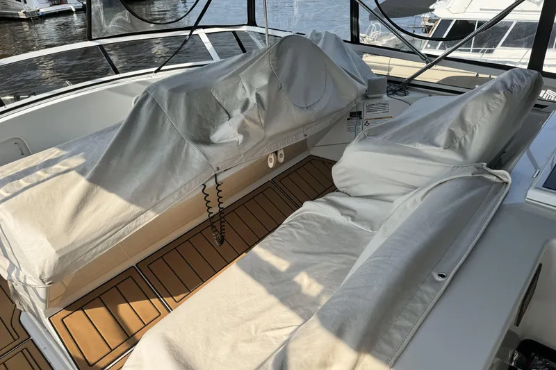 Slide: The Image of Covered seating area on a 2000 Carver 406 Aft Cabin Motor Yacht deck. - 26