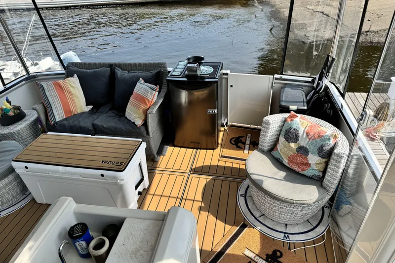Slide: The Image of Luxurious 2000 Carver 406 Aft Cabin Motor Yacht interior with cozy seating and stylish decor. - 28