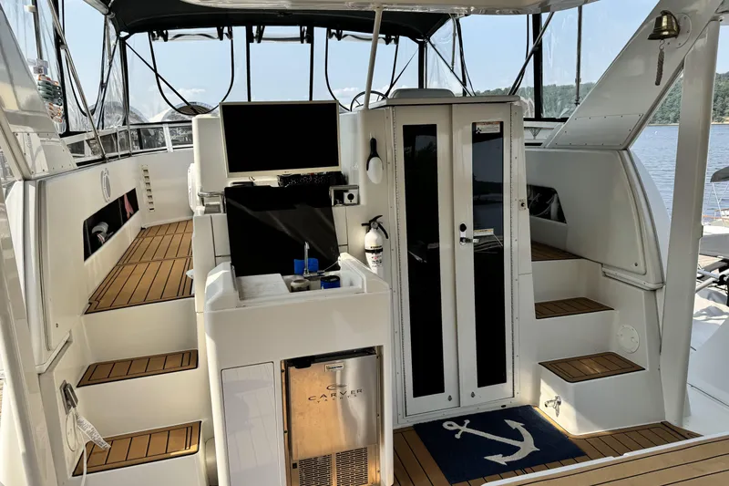 Slide: The Image of 2000 Carver 406 Aft Cabin Motor Yacht interior with wood flooring and modern amenities. - 31