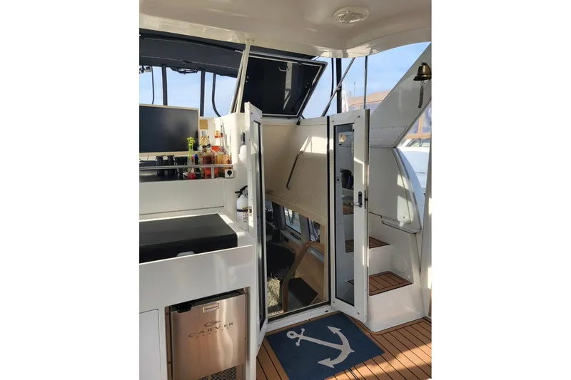 Slide: The Image of Interior of 2000 Carver 406 Aft Cabin Motor Yacht with bar and stairs. - 34