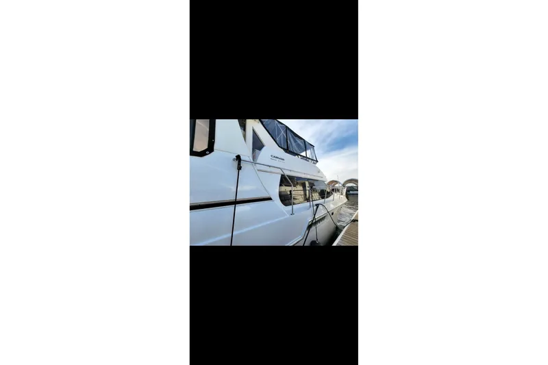 Slide: The Image of 2000 Carver 406 Aft Cabin Motor Yacht docked at marina. - 35