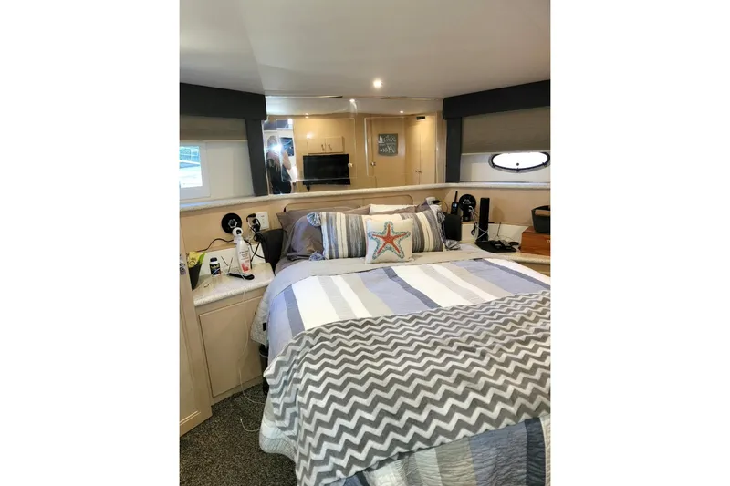 Slide: The Image of Cozy bedroom interior of 2000 Carver 406 Aft Cabin Motor Yacht with nautical decor. - 39