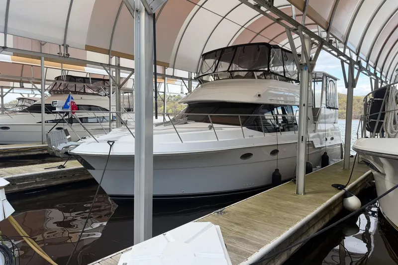 Slide: The Image of 2000 Carver 406 Aft Cabin Motor Yacht docked under covered marina. - 47