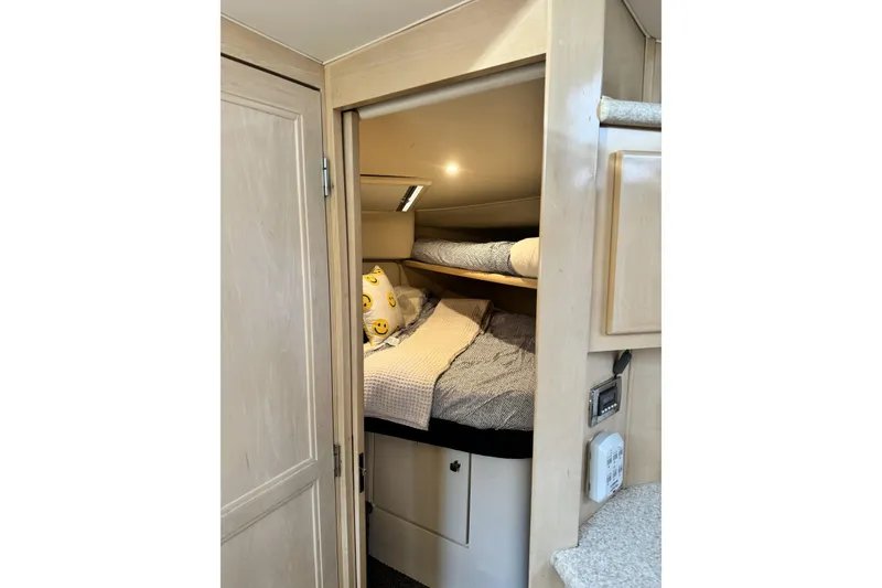 Slide: The Image of Cozy cabin interior of 2000 Carver 406 Aft Cabin Motor Yacht with bunk beds. - 6