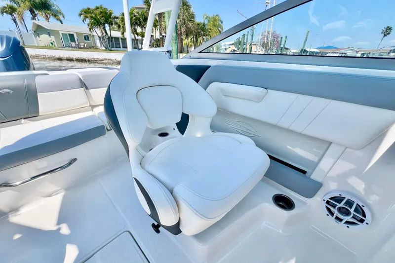 Slide: The Image of 2023 Chaparral 21 SSi OB boat interior with white seating and modern design. - 14