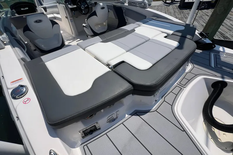 Slide: The Image of 2023 Chaparral 21 SSi OB boat interior with cushioned seating and modern design. - 5
