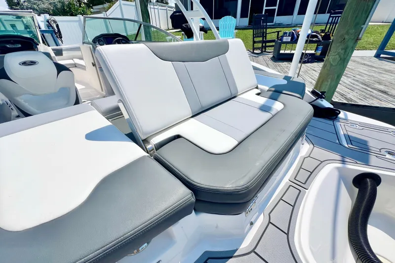 Slide: The Image of 2023 Chaparral 21 SSi OB boat interior with gray and white seating. - 6