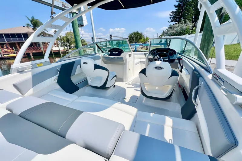 Slide: The Image of 2023 Chaparral 21 SSi OB boat interior with modern seating and steering wheel. - 8