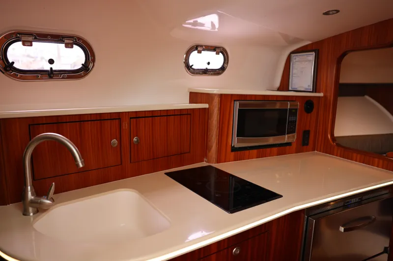 Slide: The Image of Interior view of 2015 Pursuit OS 385 Offshore boat cockpit with Garmin navigation system. - 20