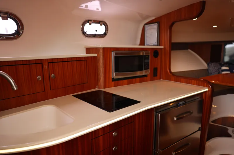 Slide: The Image of Luxurious interior of 2015 Pursuit OS 385 Offshore yacht with elegant dining area. - 21