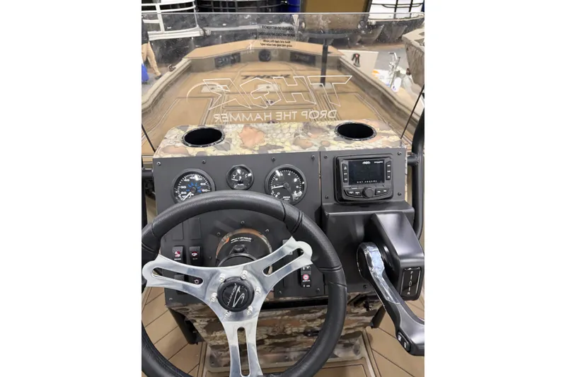 Slide: The Image of Cockpit of 2026 Thor Lake Hammer 1900 boat with steering wheel and control panel. - 4
