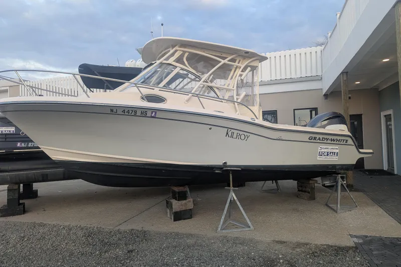 The Image of 2023 Grady-White Adventure 218 boat on display, labeled "Kilroy," with a "For Sale" sign. - 0