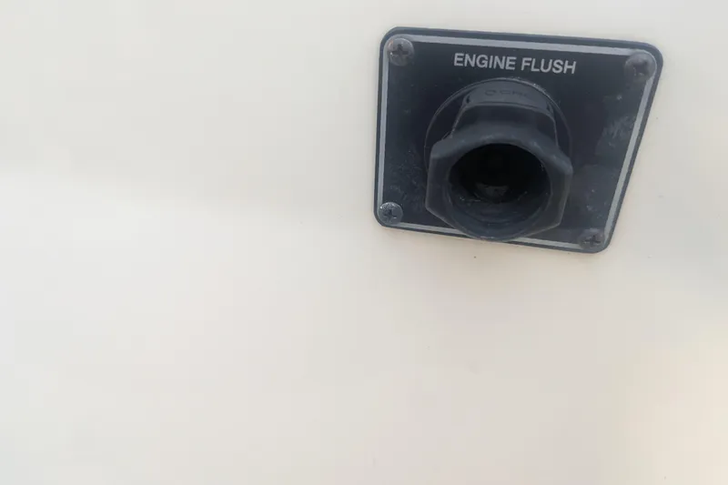 Slide: The Image of Engine flush port on 2023 Grady-White Adventure 218 boat. - 13