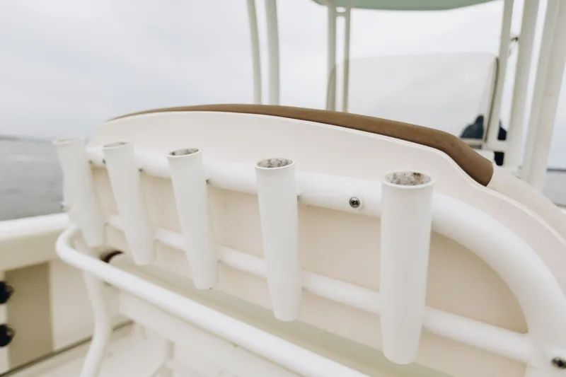 Slide: The Image of 2017 Robalo R222 Center Console boat with rod holders on the backrest. - 11