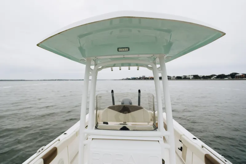 Slide: The Image of 2017 Robalo R222 Center Console boat on open water, featuring a sleek design. - 13