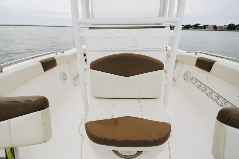 Slide: The Image of 2017 Robalo R222 Center Console boat interior with cushioned seating. - 6