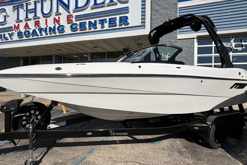 The Image of 2026 MB SPORTS F21 Classic boat on trailer at marine center. - 1