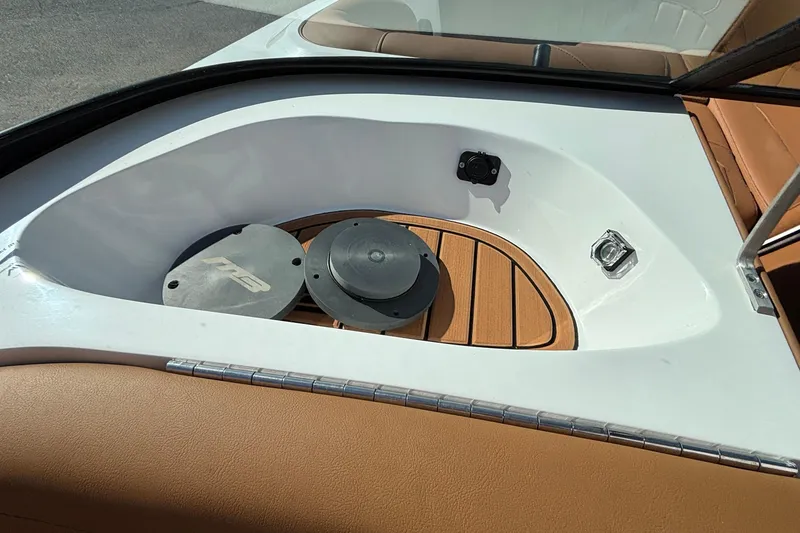 Slide: The Image of 2026 MB SPORTS F21 Classic boat interior with tan seating and wooden accents. - 13