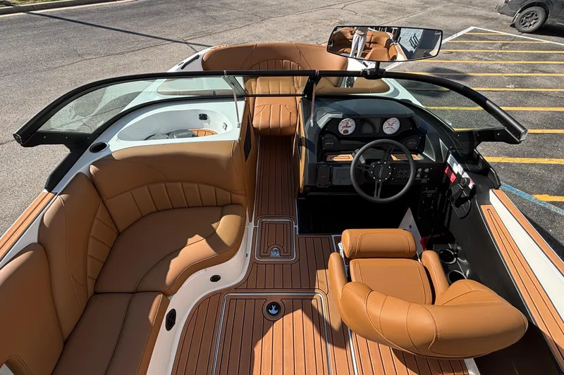 Slide: The Image of 2026 MB SPORTS F21 Classic boat interior with tan leather seating and modern dashboard. - 14