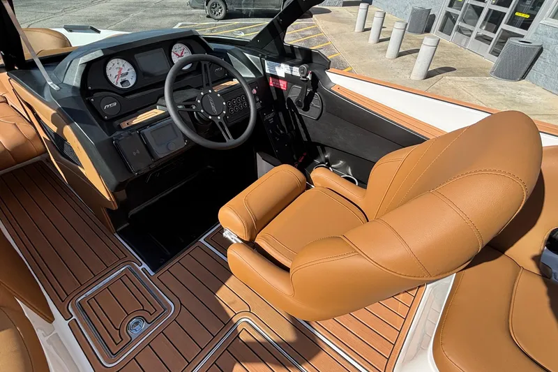 Slide: The Image of 2026 MB SPORTS F21 Classic boat interior with tan leather seats and modern dashboard. - 15