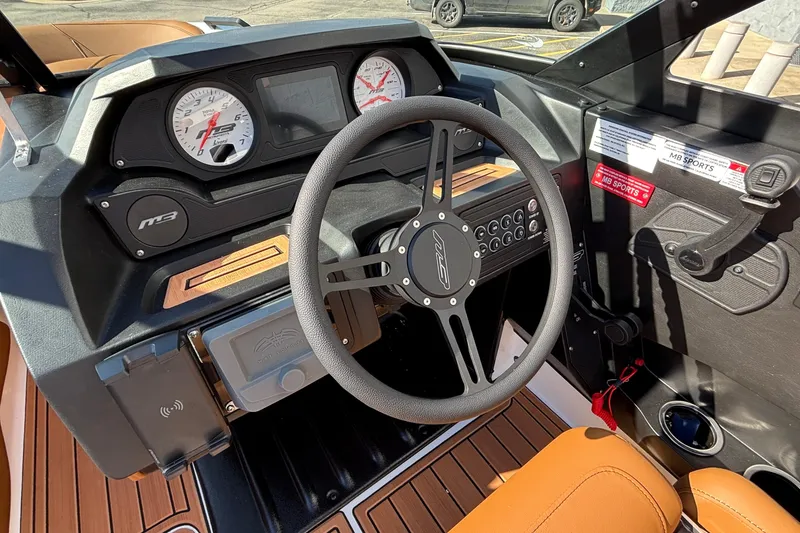 Slide: The Image of 2026 MB SPORTS F21 Classic boat dashboard with steering wheel and gauges. - 16