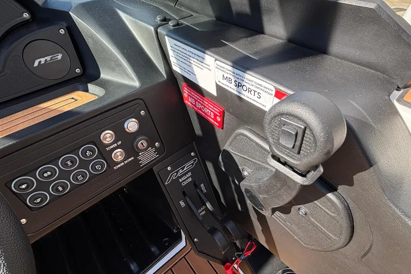 Slide: The Image of Dashboard of 2026 MB SPORTS F21 Classic boat with control panel and branding. - 18