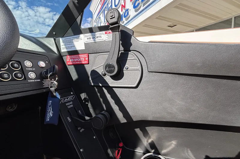 Slide: The Image of Interior view of 2026 MB SPORTS F21 Classic boat dashboard with controls and branding. - 20