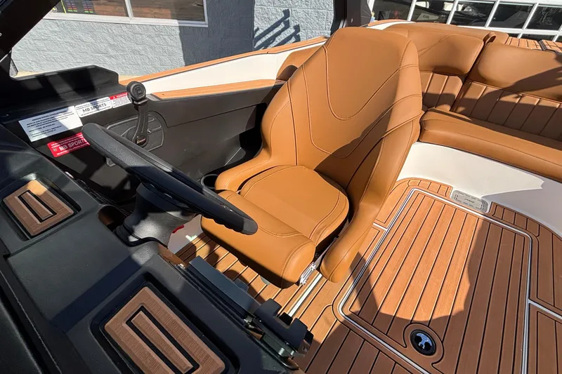 Slide: The Image of 2026 MB SPORTS F21 Classic boat interior with tan leather seating and wood accents. - 27