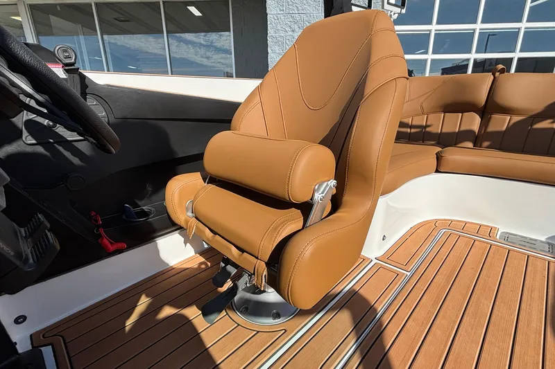 Slide: The Image of 2026 MB SPORTS F21 Classic boat interior with tan leather seating and wood flooring. - 28