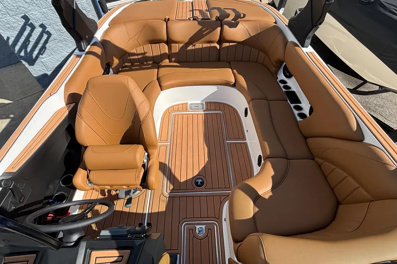 Slide: The Image of 2026 MB SPORTS F21 Classic boat interior with tan leather seating and wood accents. - 29