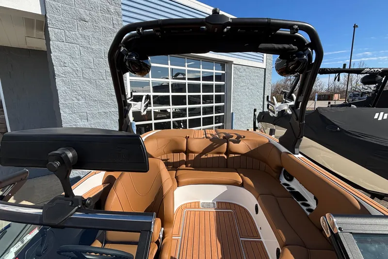 Slide: The Image of 2026 MB SPORTS F21 Classic boat interior with tan seating and sleek design. - 30