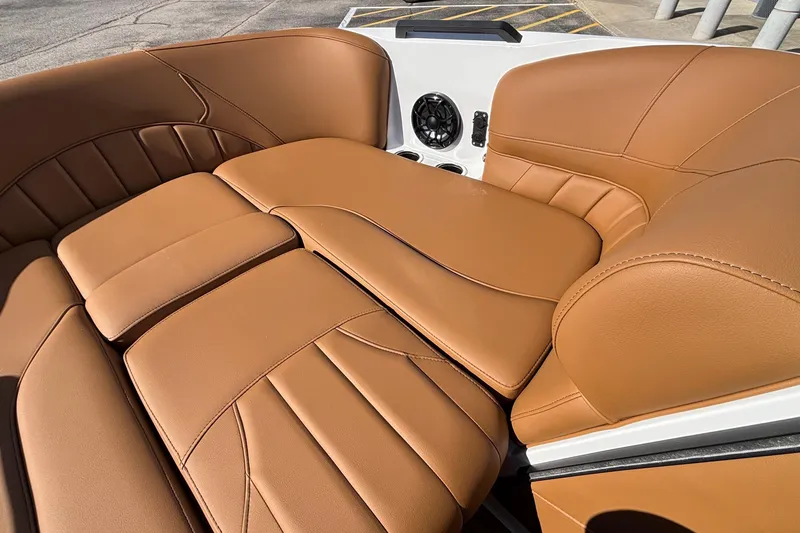 Slide: The Image of 2026 MB SPORTS F21 Classic boat interior with tan leather seating and speaker system. - 33